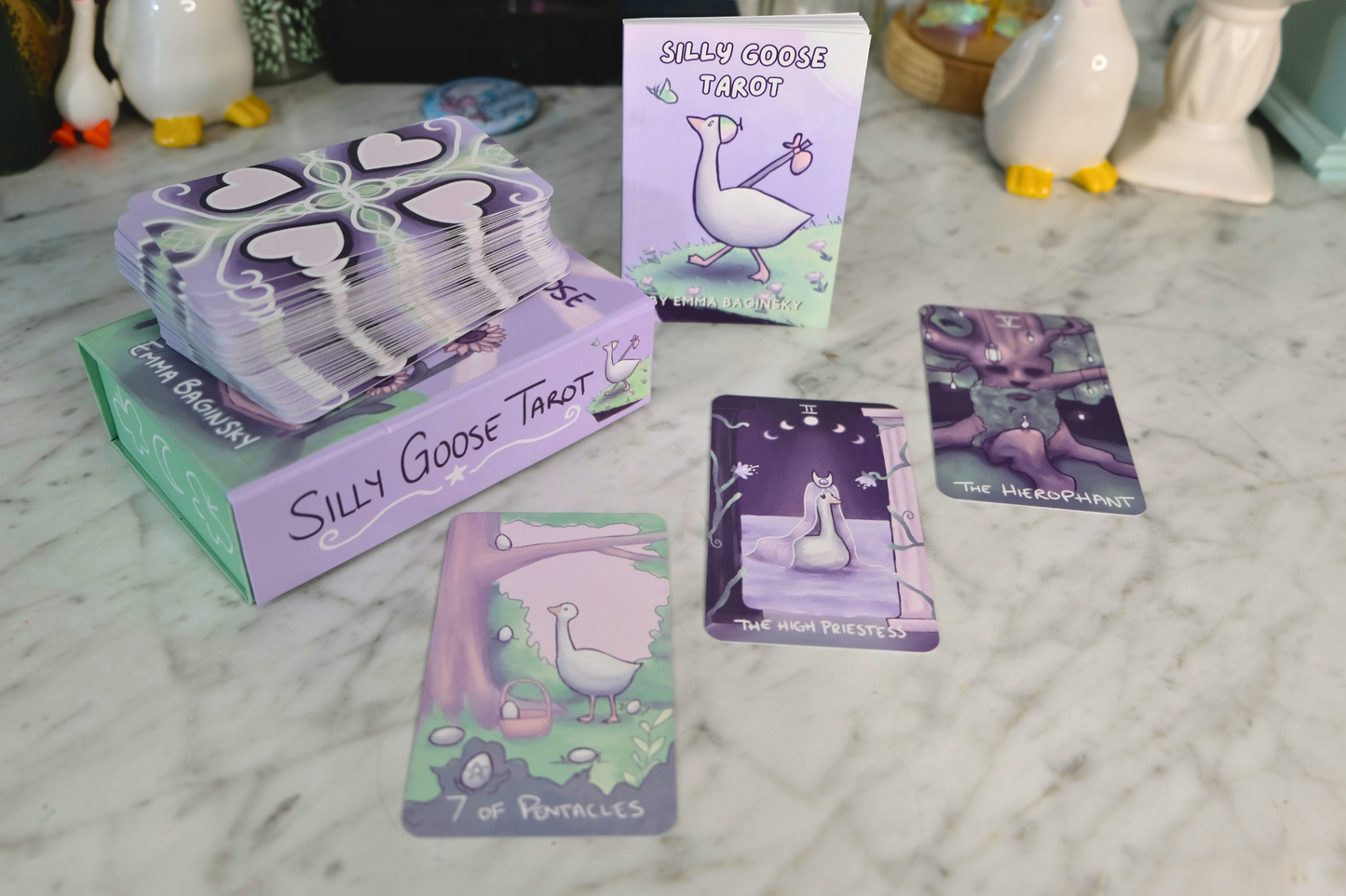 Silly Goose Tarot cards and packaging on a marble surface