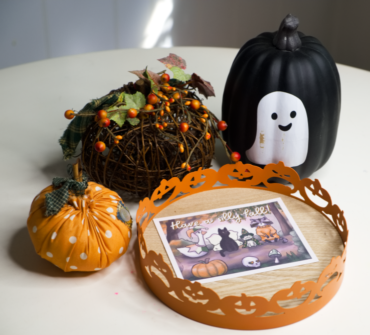 Fall Friends Postcard surrounded by pumpkin decorations